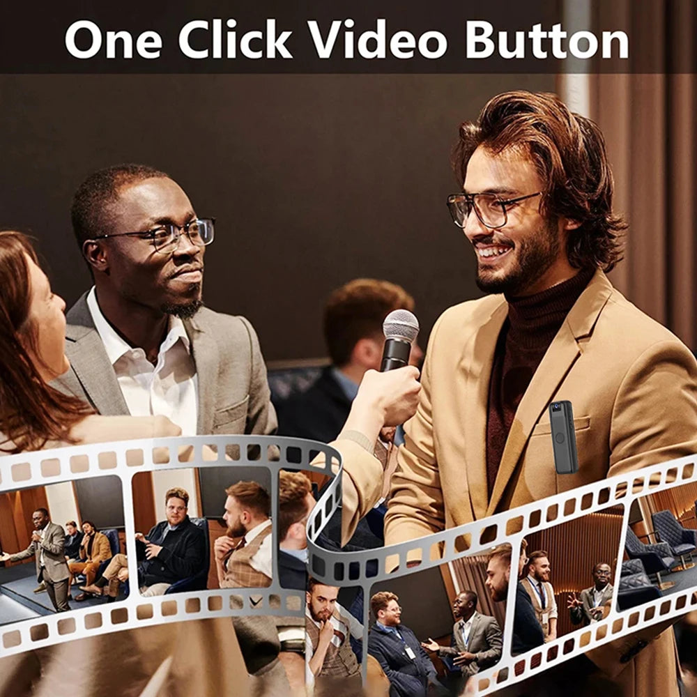 A small, black, rectangular portable video camera clipped to a man's beige blazer jacket.