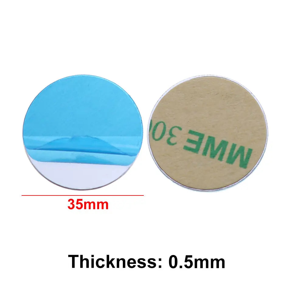 Two 35mm round adhesive discs, one showing a blue backing and the other a tan backing with green text.