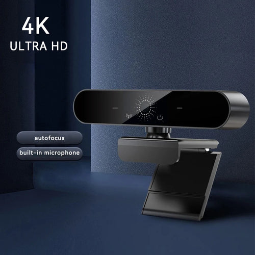 Sleek matte black 4K Ultra HD webcam with autofocus, built-in microphone and adjustable stand on a blue background.