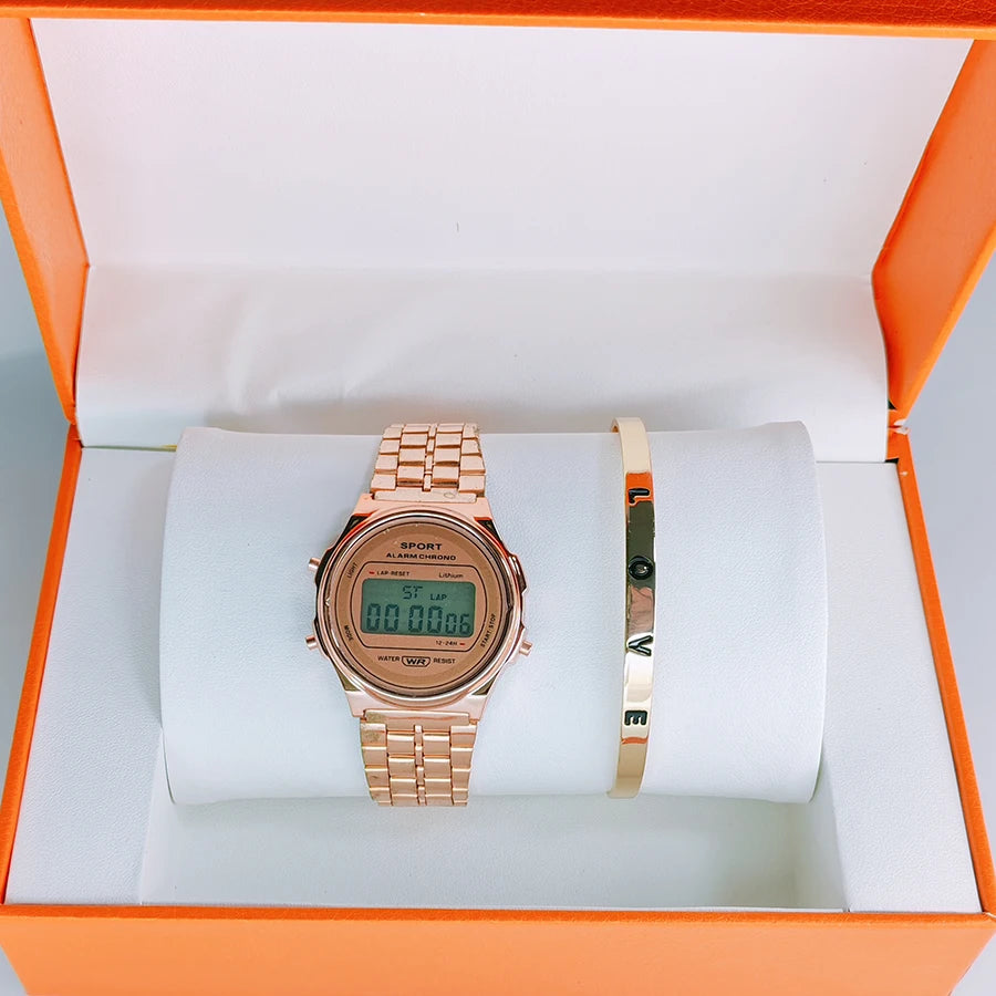 Rose gold digital watch and 'LOVE' bangle set in an orange gift box.