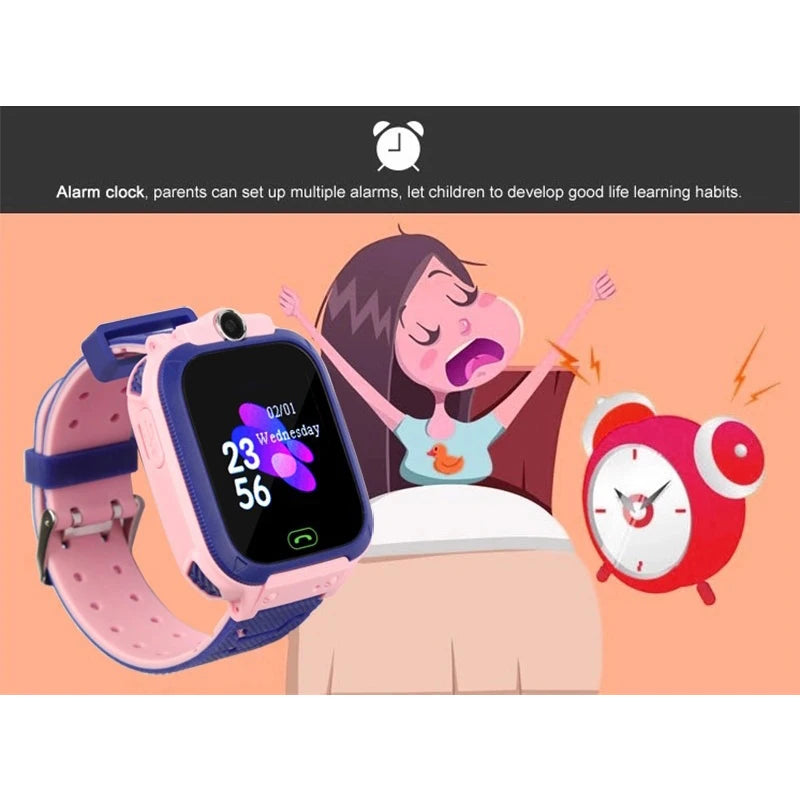 Pink and blue kids' smart watch with digital display, camera, and alarm feature, shown with cartoon illustration.