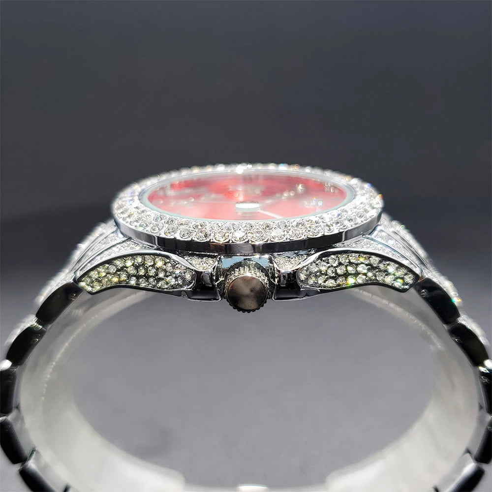 Side view of a silver-tone women's dress watch with a vibrant red dial and crystal-encrusted bezel and lugs.