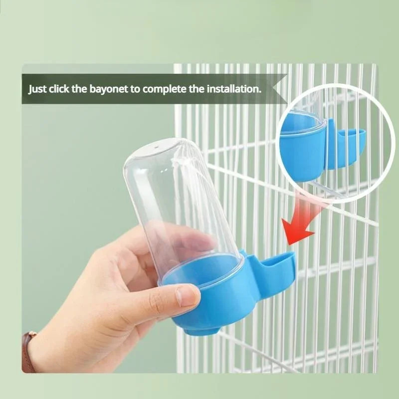 A blue and clear plastic bird water dispenser being attached to a white wire cage.