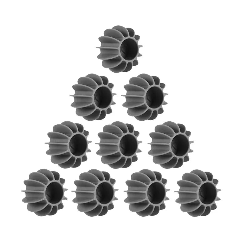 Ten grey, ribbed circular silicone protective bumpers for glass bottle bases arranged in a triangle.