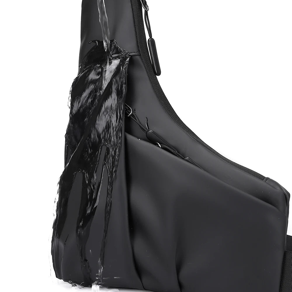 Water-resistant black triangle crossbody chest bag with slim, sleek design and zip compartments.