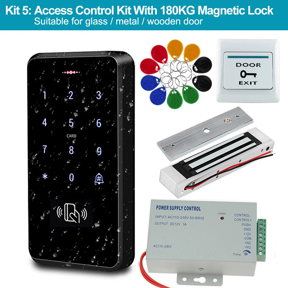 Access control kit with black keypad, metallic magnetic lock, white exit button, power box, and colorful key fobs.