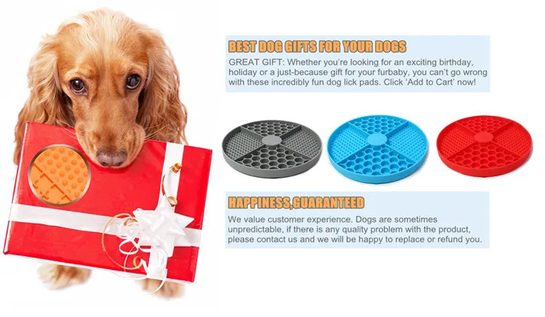 A dog holding a gift box next to three round, textured silicone lick mats in grey, blue, and red.