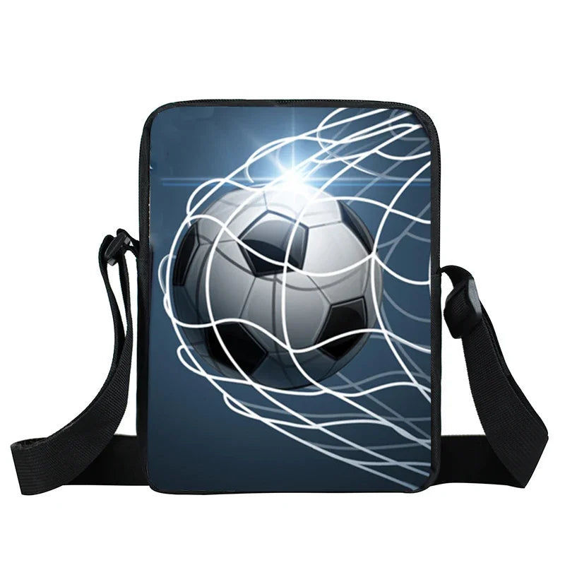 Black shoulder bag featuring a graphic print of a football hitting a goal net against a dark blue background.