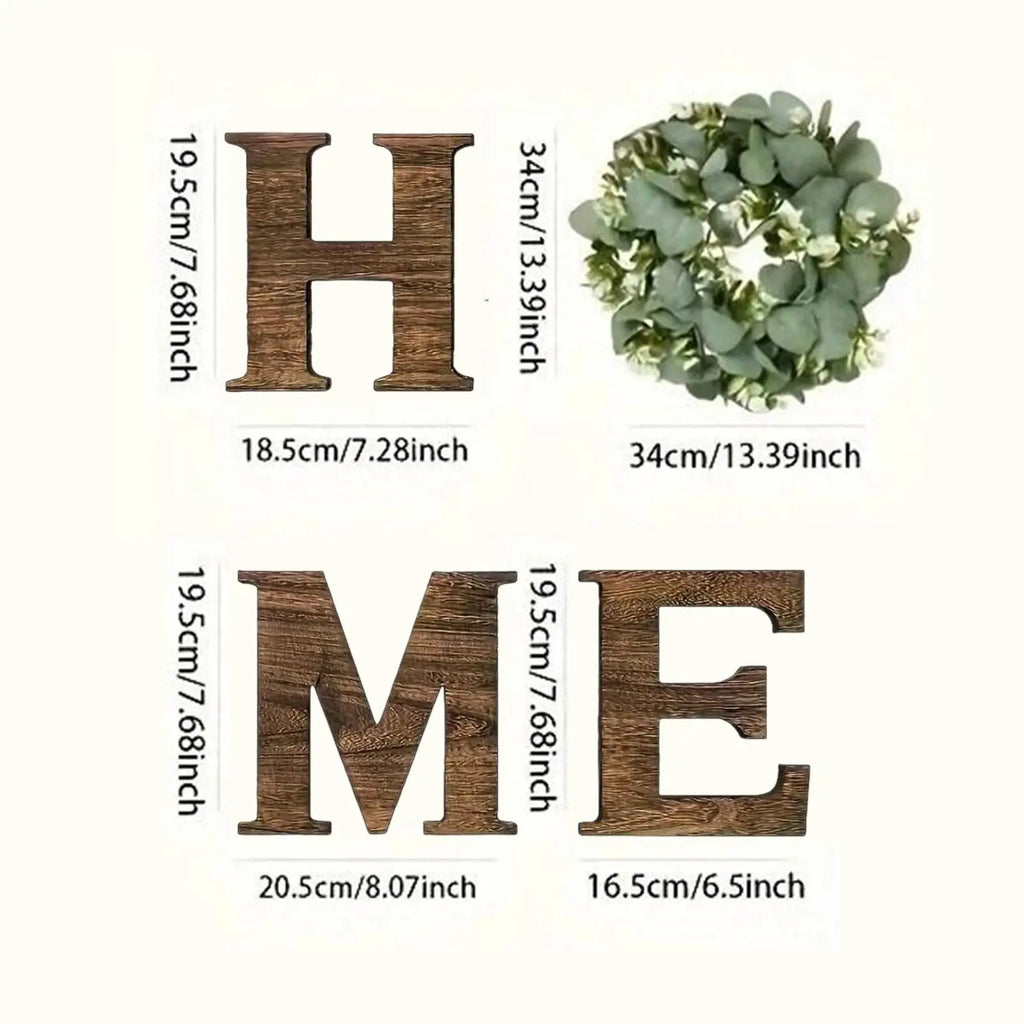 Rustic wooden 'HOME' sign with dark wood grain letters and a circular artificial eucalyptus wreath for the 'O'.