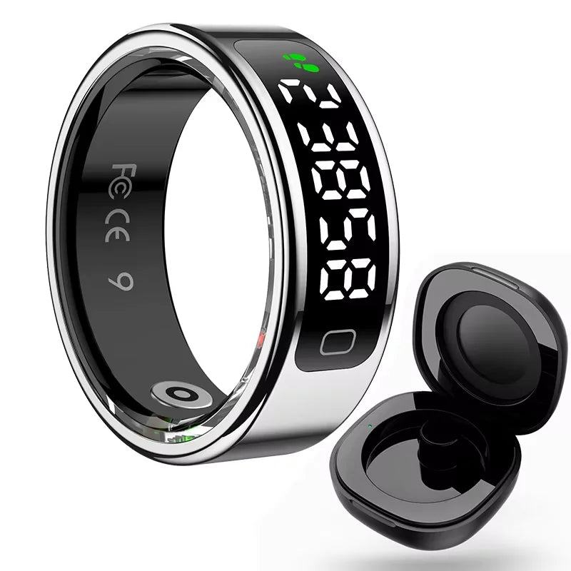 A sleek black and silver smart health ring with a digital LED display, shown alongside its small charging case.