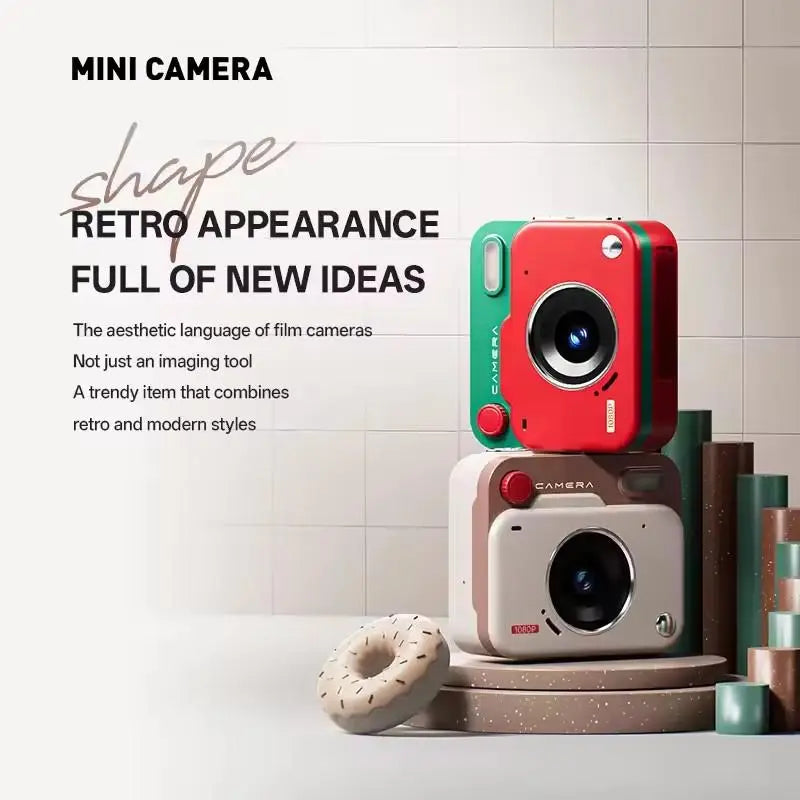 Two plastic mini cameras, one red and green and one beige and brown, stacked on a platform with decorative objects.