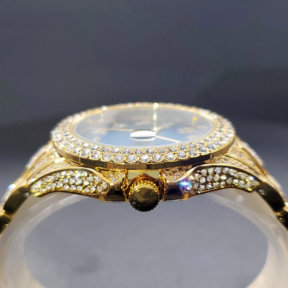 Side view of an elegant gold-tone dress watch encrusted with sparkling crystals on the bezel and lugs.
