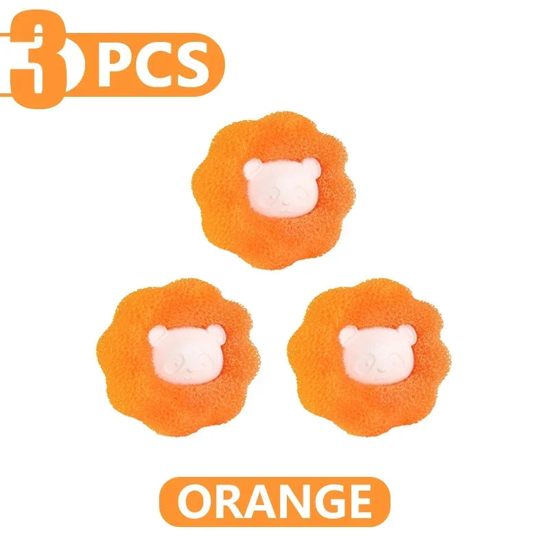 Three orange, flower-shaped sponges, each with a cute pink panda face in the centre.