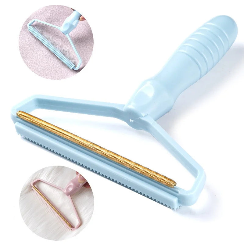 Light blue manual fabric lint and pet hair remover with a gold-tone metal scraping edge.