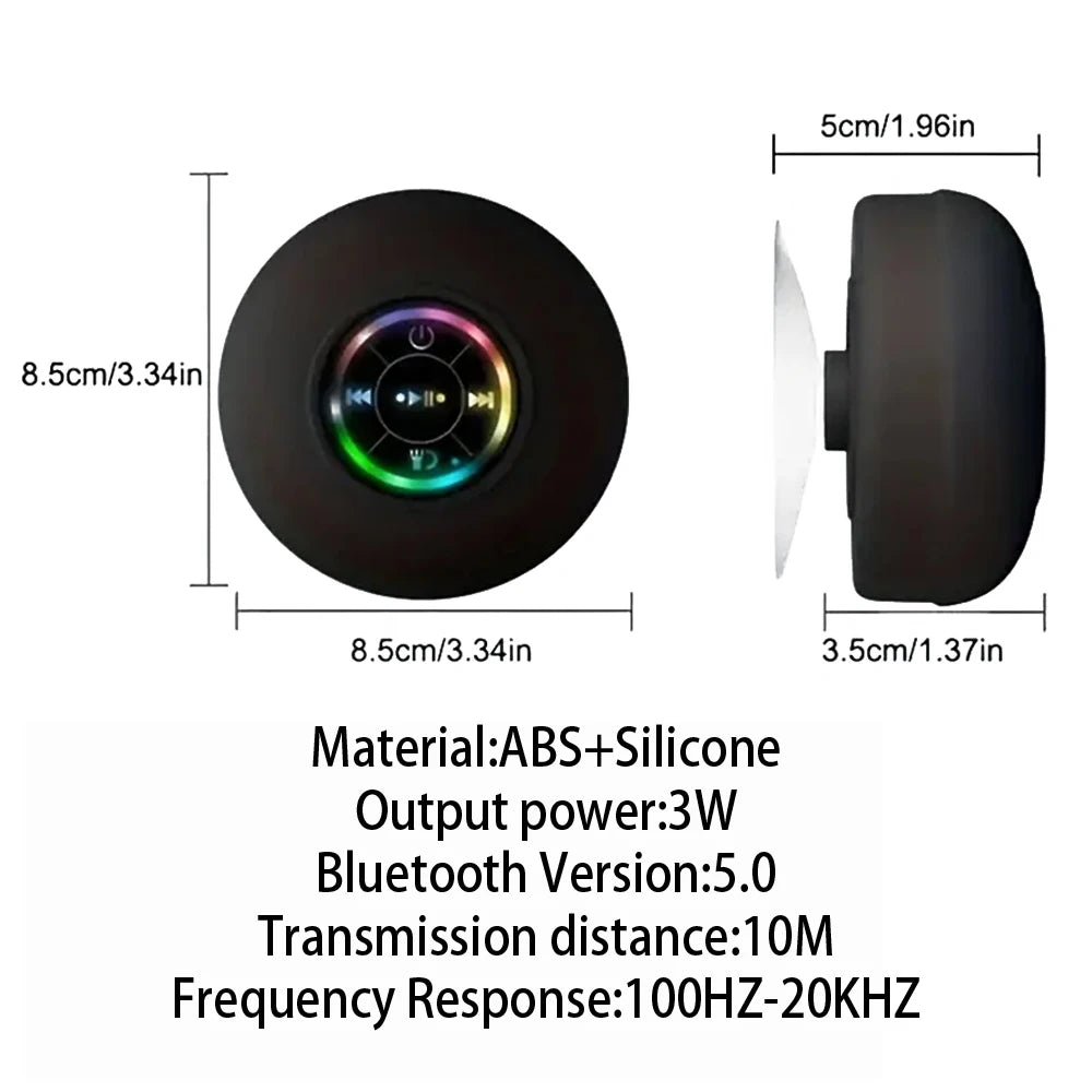 Black circular portable shower speaker with a suction cup, LED light ring, and integrated playback controls.
