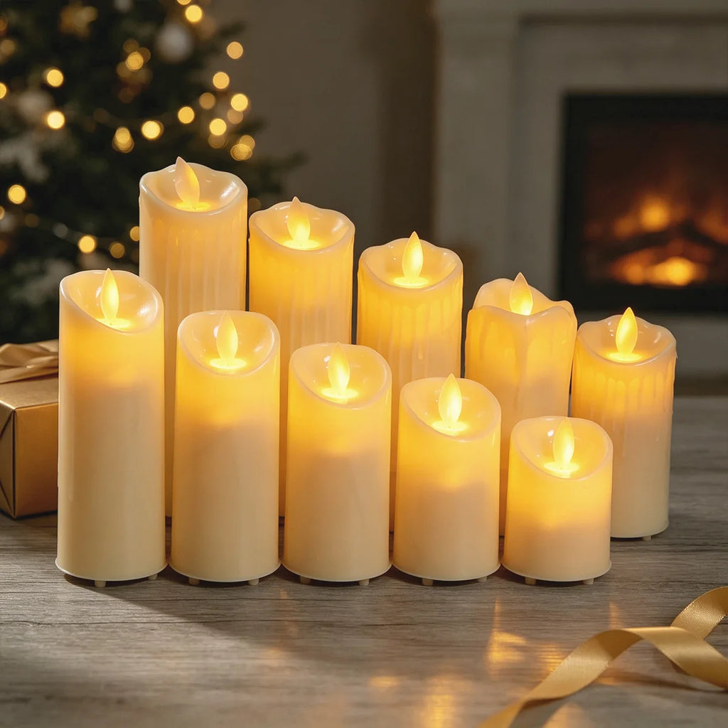 Ivory flameless pillar LED candles with warm glowing flickering flames arranged on a wooden table.
