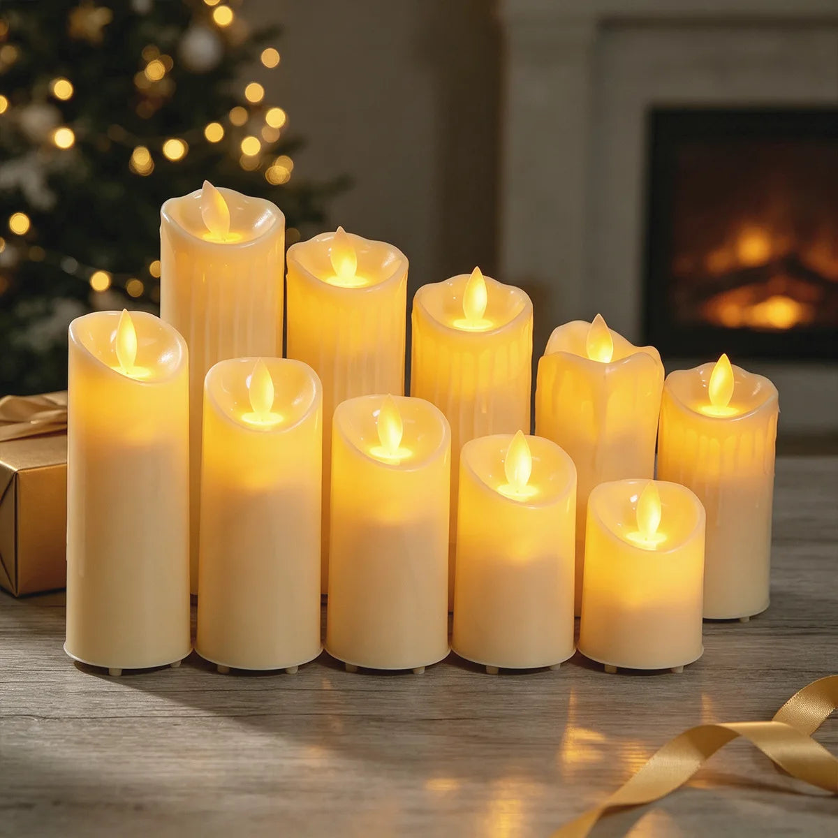 Ivory flameless pillar LED candles with warm glowing flickering flames arranged on a wooden table.