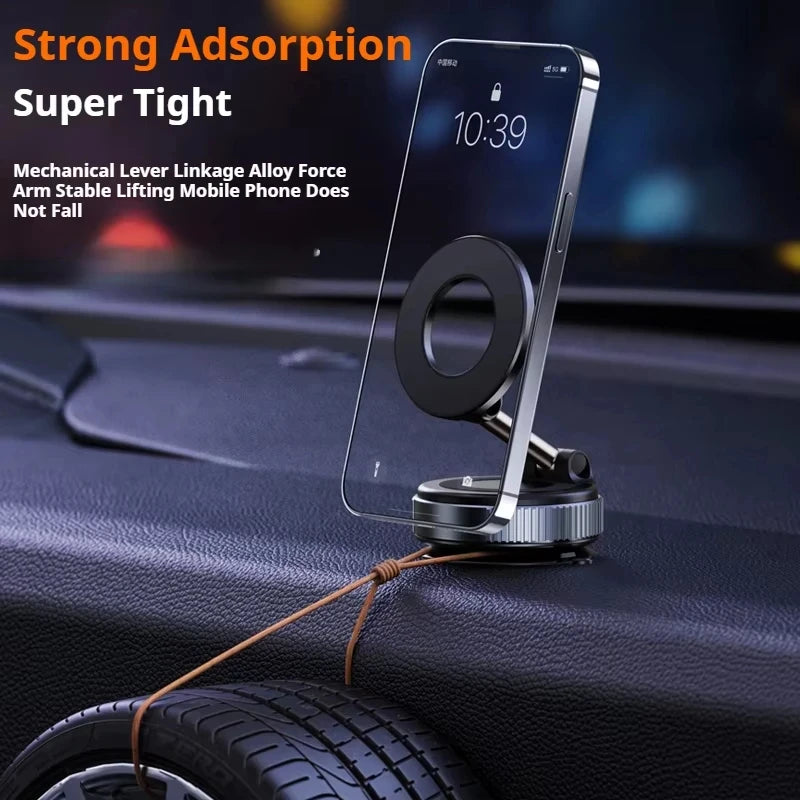 A sleek black and silver magnetic car phone mount secured on a dashboard, holding a smartphone upright.