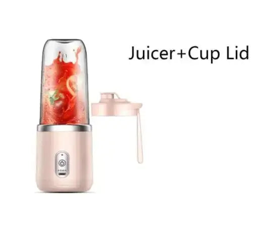 A portable pink personal blender with a transparent cup containing red juice and a matching pink lid.