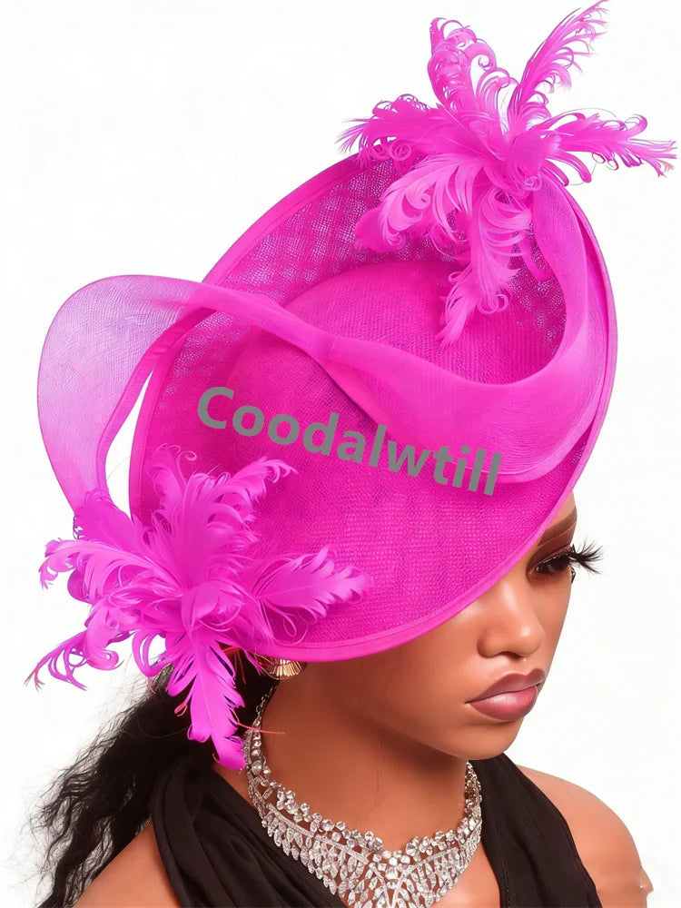 Elegant hot pink fascinator headpiece featuring sinamay fabric, sheer ribbon loops, and decorative feather sprays.