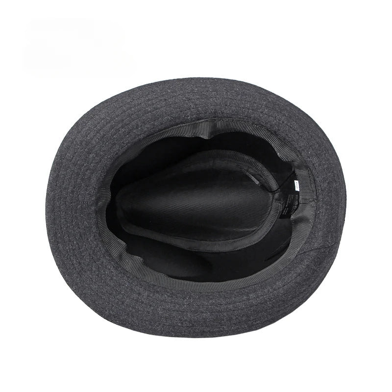 Top-down view of a dark grey felt fedora jazz hat, showing the black fabric lining and internal rim detail.