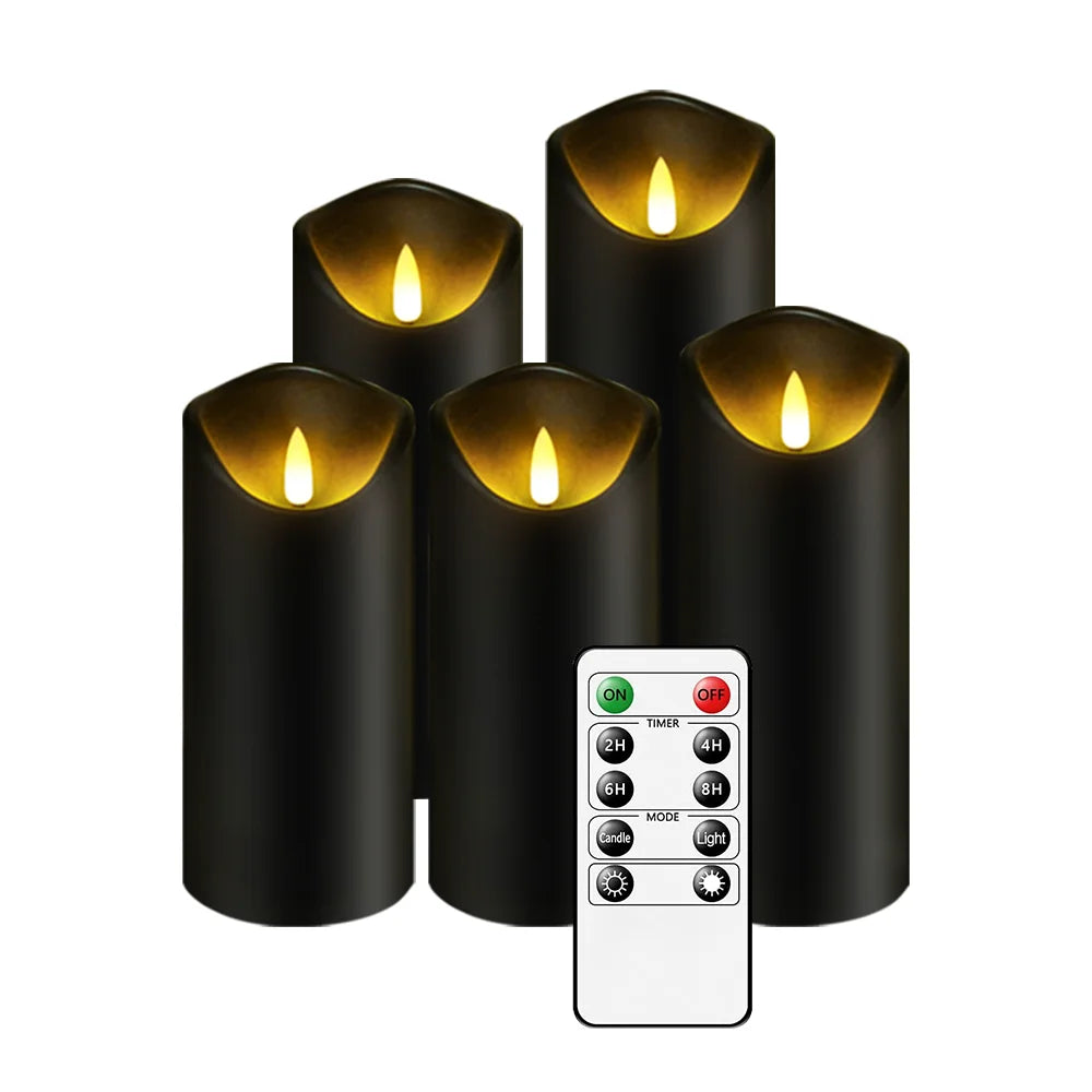 Five black cylindrical flameless LED candles with glowing amber flame tips, accompanied by a remote control.