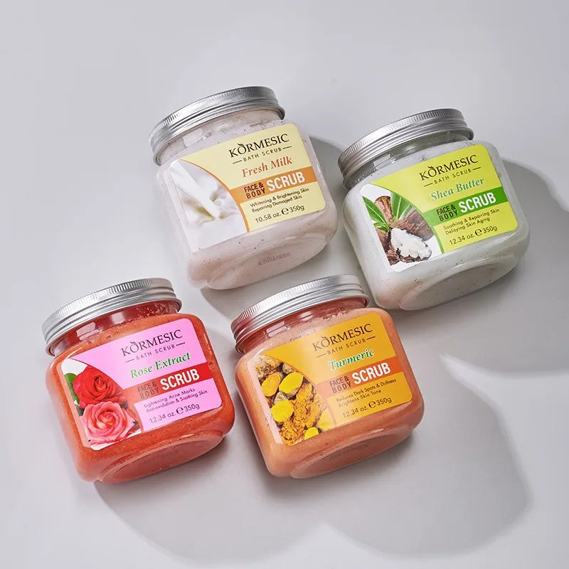 Four 350g jars of face and body scrub in Milk, Shea Butter, Rose, and Turmeric scents with silver metal lids.