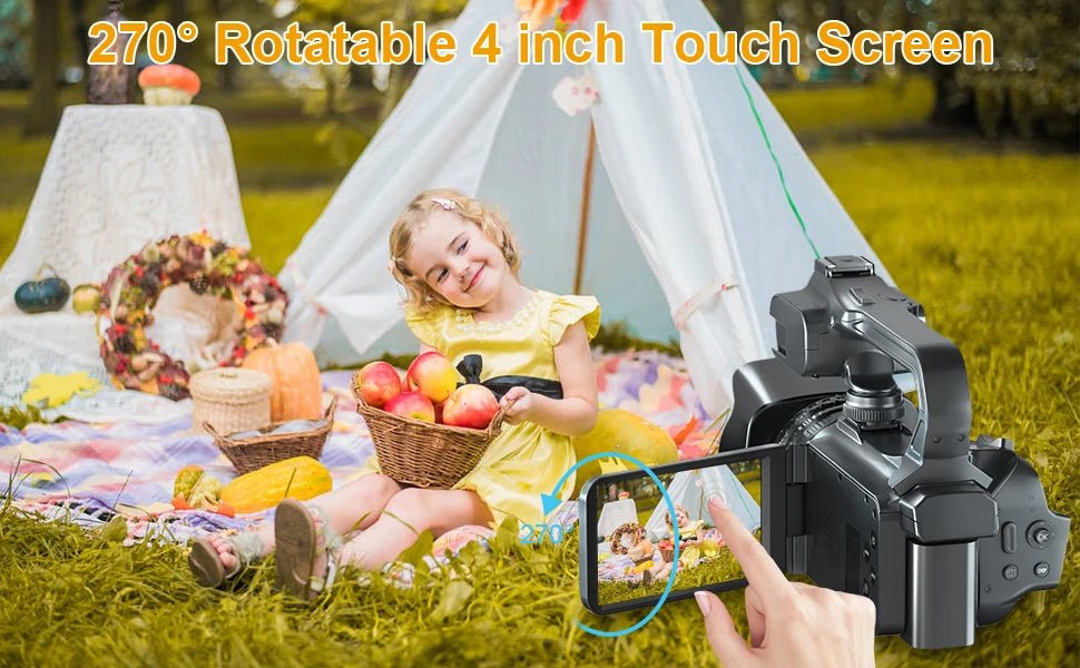 Black plastic video camera with a 4-inch 270-degree rotatable touch screen being used outdoors.