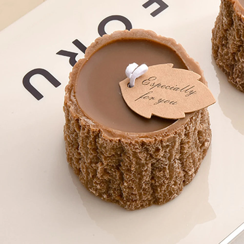 Brown tree stump-shaped candle with a smooth top and textured bark sides, featuring an 'Especially for you' leaf tag.