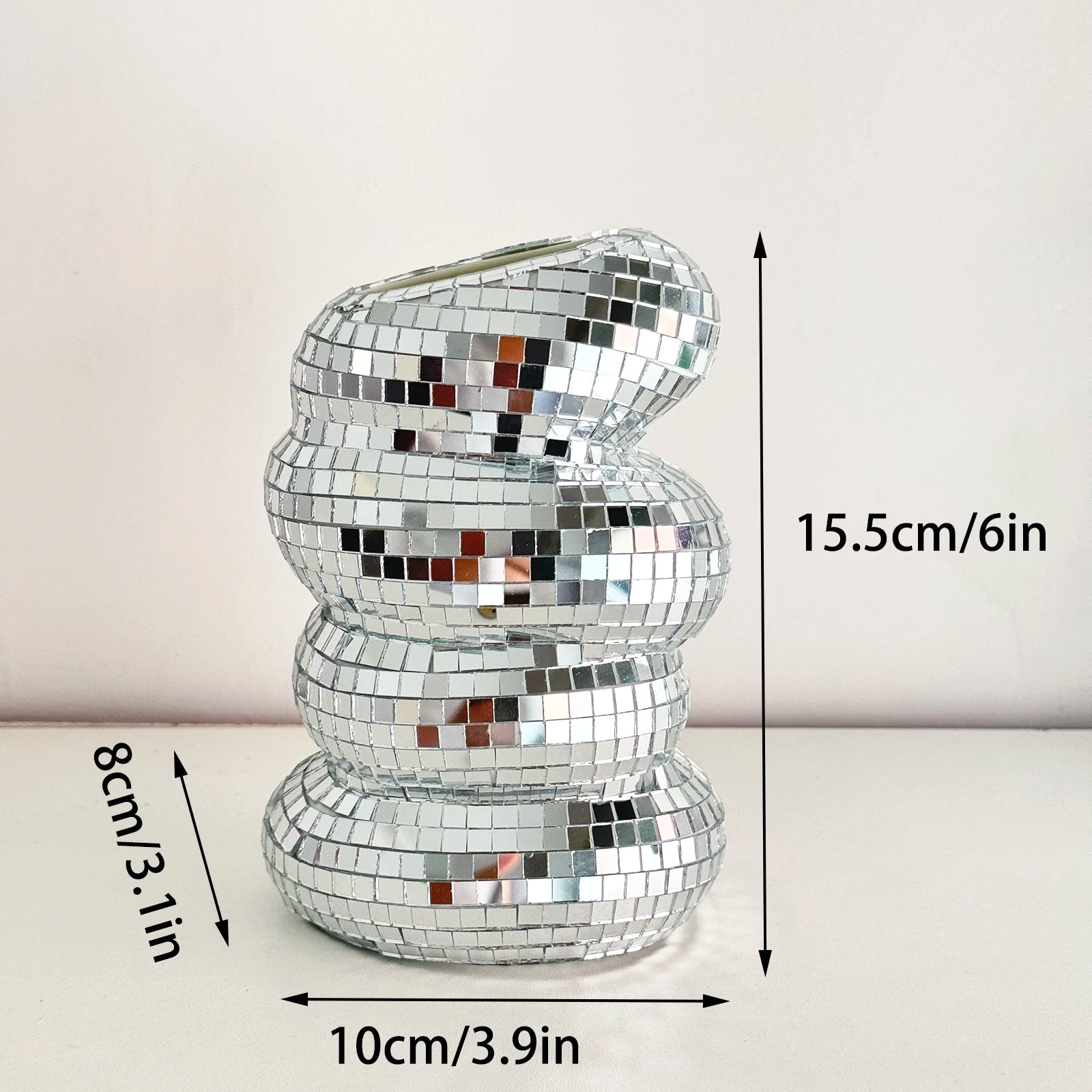 A silver, stacked-ring style disco ball flower vase, featuring reflective mirror tiles. Dimensions shown as 15.5cm tall.