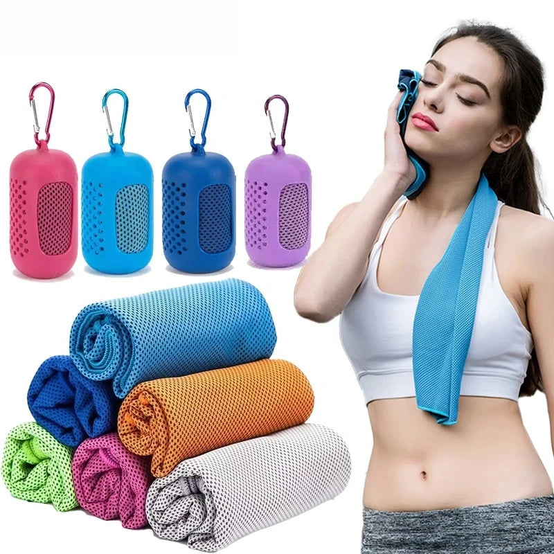 A woman using a blue cooling sports towel, with a stack of colourful rolled towels and matching carabiner cases.