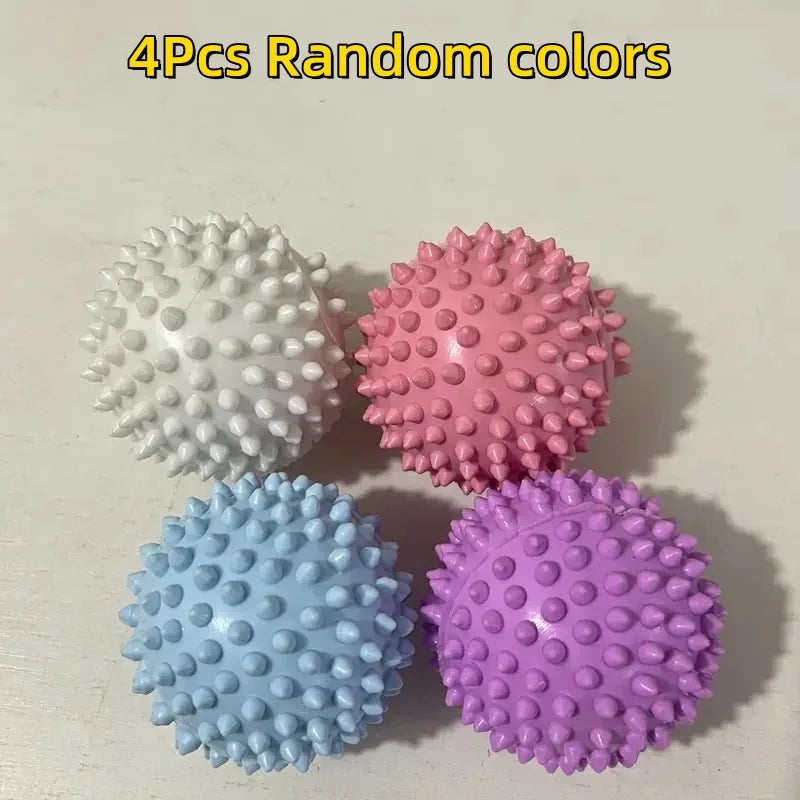 Four spiky sensory massage balls in white, pink, light blue, and purple.