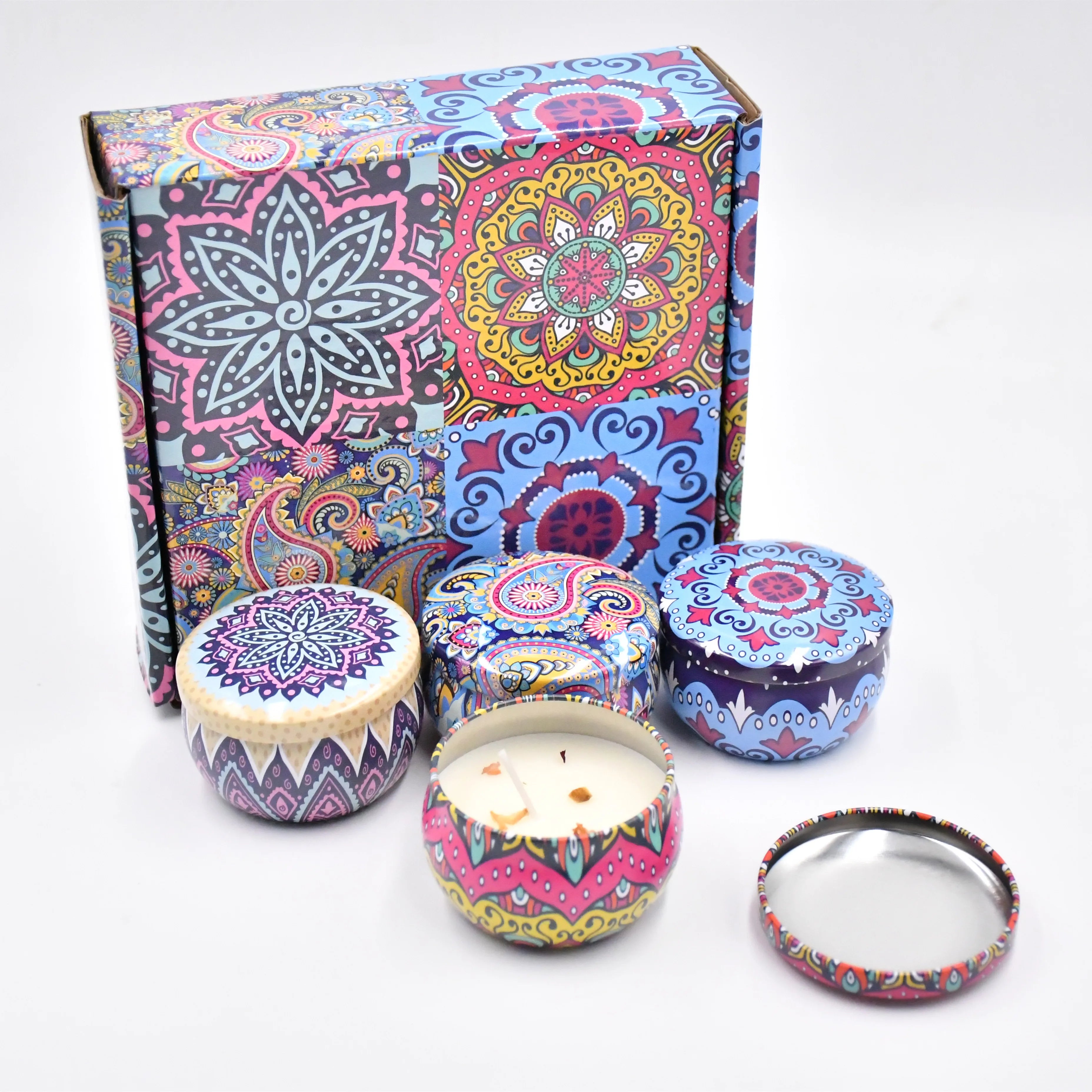 Set of four colourful, mandala-patterned candle tins and a matching decorative gift box.