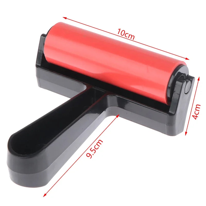 Red craft roller with black handle, shown with dimensions indicating a 10cm roller width and 9.5cm handle length.