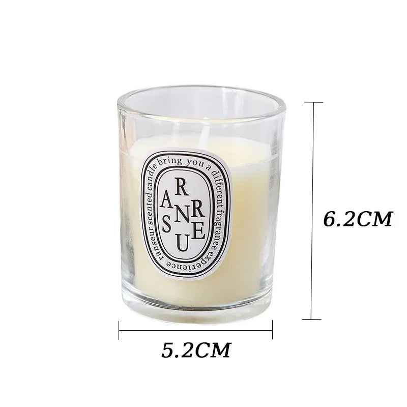 Cream-coloured scented candle in a clear glass votive holder with a round decorative label, measuring 5.2cm x 6.2cm.