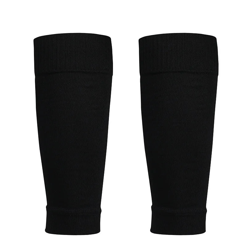 Pair of plain black sports compression calf sleeves with elasticated ribbed cuffs, isolated on a white background.