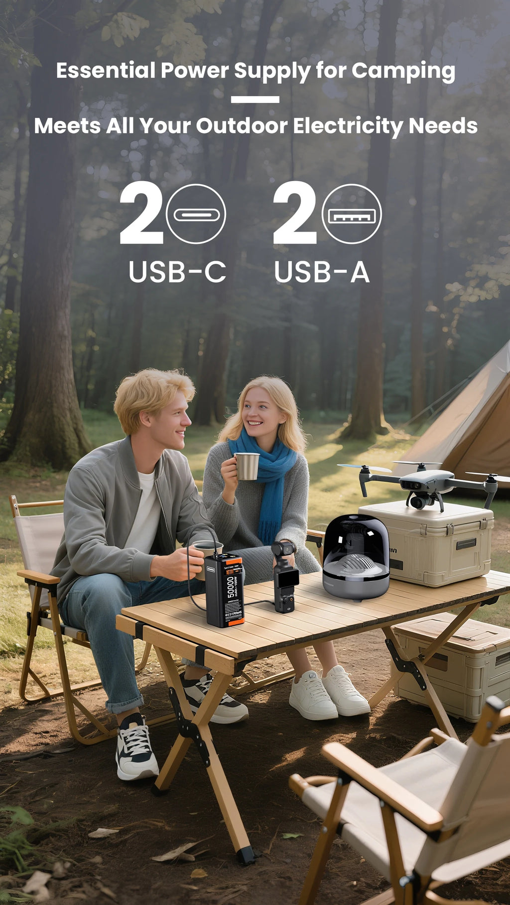 Black 50000mAh 100W portable power bank with 2 USB-C and 2 USB-A ports, charging devices at a campsite.