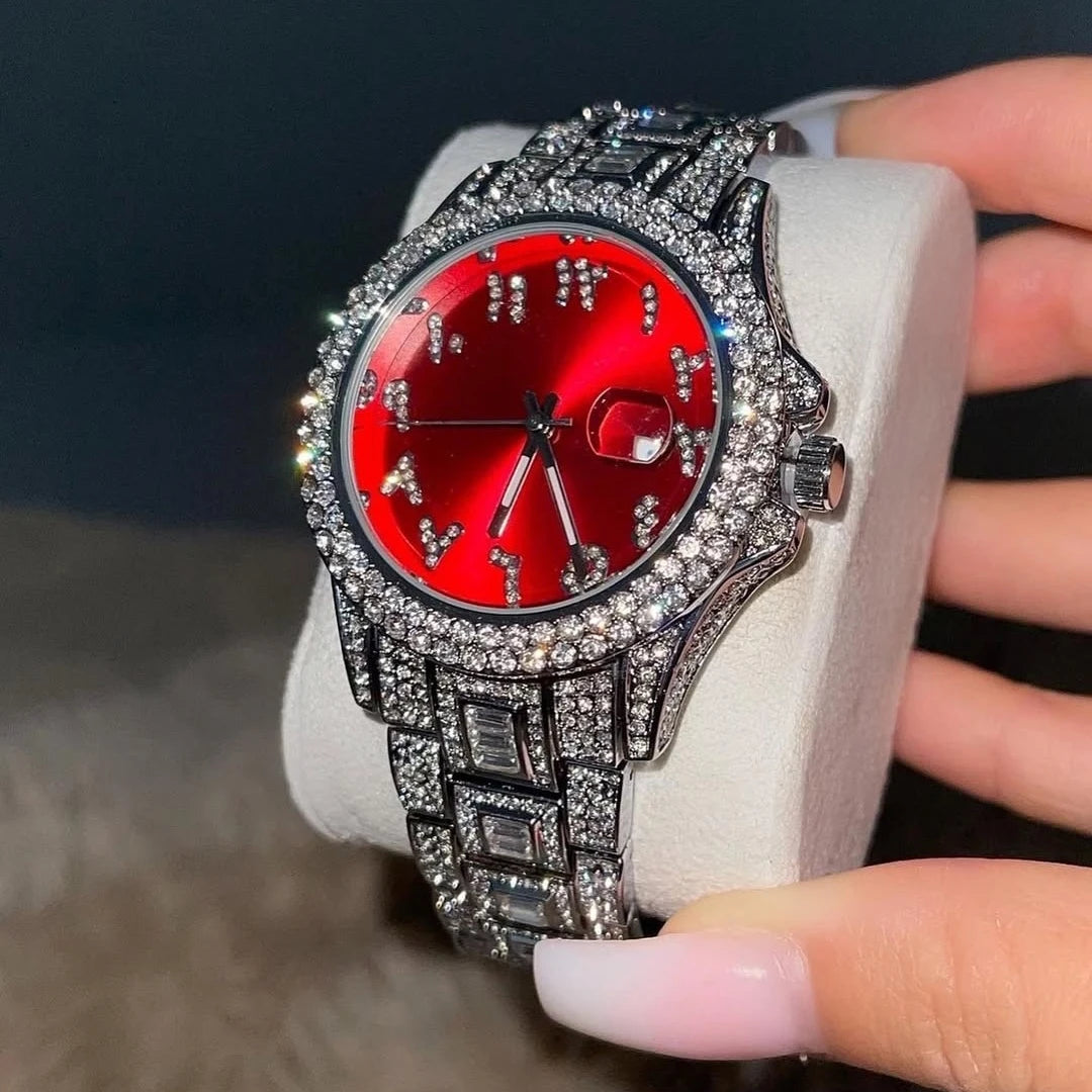 Elegant women's watch with a vibrant red dial, crystal-encrusted bezel, and a sparkling diamanté link strap.