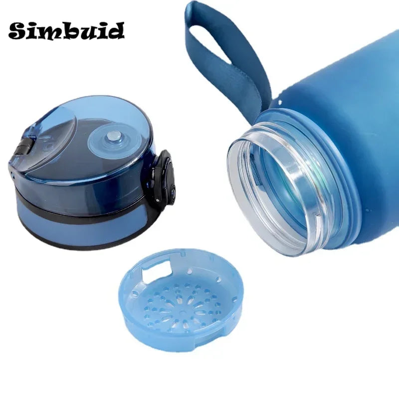 Blue frosted water bottle with a detachable strainer, flip-top lid, and carrying strap against a white background.