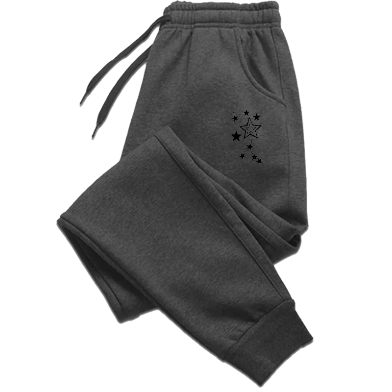 Charcoal grey joggers with an elasticated drawstring waist, cuffed ankles, and a black star print pattern.