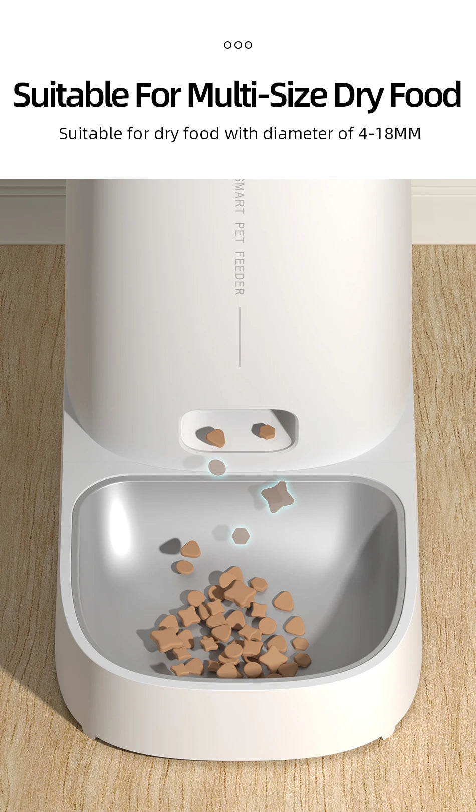Modern white smart pet feeder dispensing dry kibble into a sleek, metallic-look removable feeding bowl.