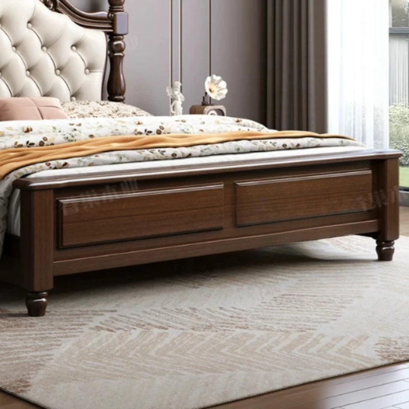 Retro dark wood double bed frame featuring a cream, button-tufted upholstered headboard and elegant turned feet.