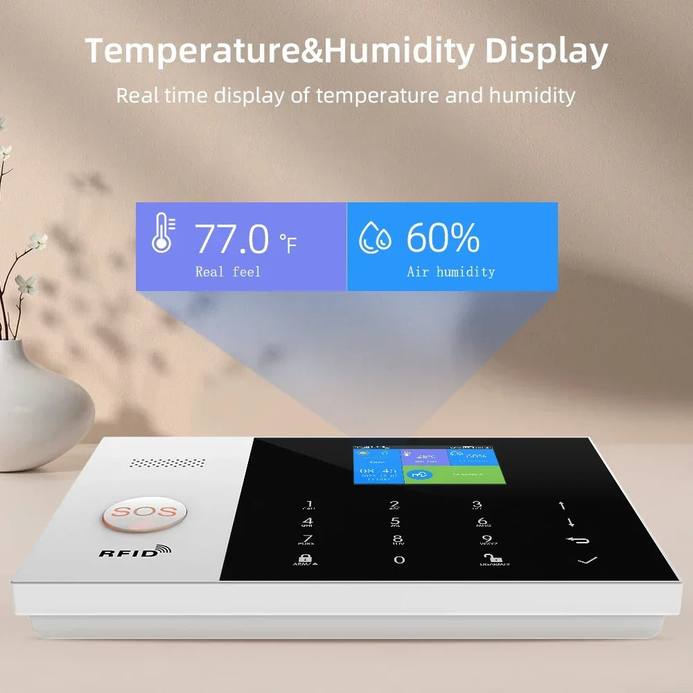 Sleek white and black smart alarm panel with touch keypad, SOS button, RFID reader, and temperature/humidity display.