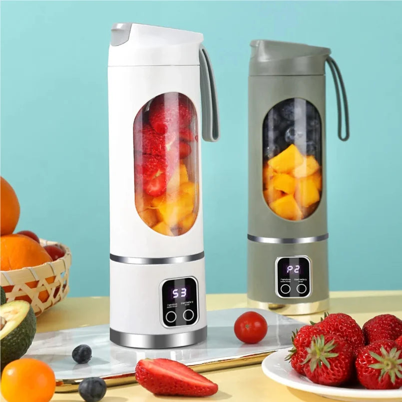 Two portable electric blenders in white and green, each with a clear fruit-filled chamber and a digital display base.