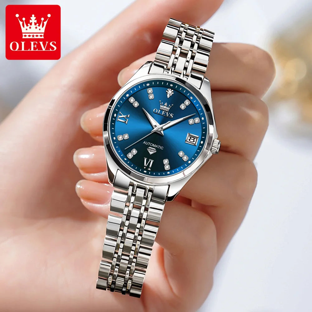 Elegant women's stainless steel automatic watch with a blue sunray dial, crystal hour markers, and date display.