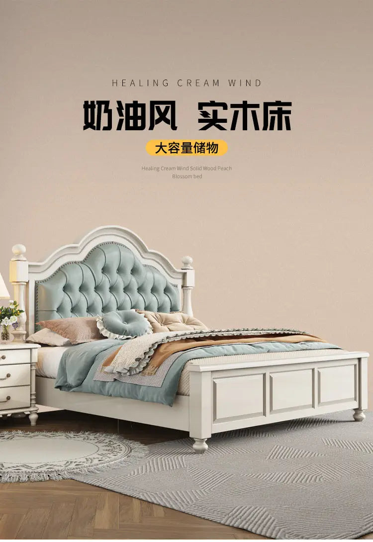 Cream-coloured wooden double bed frame with a tufted sage-green upholstered headboard and panelled footboard.