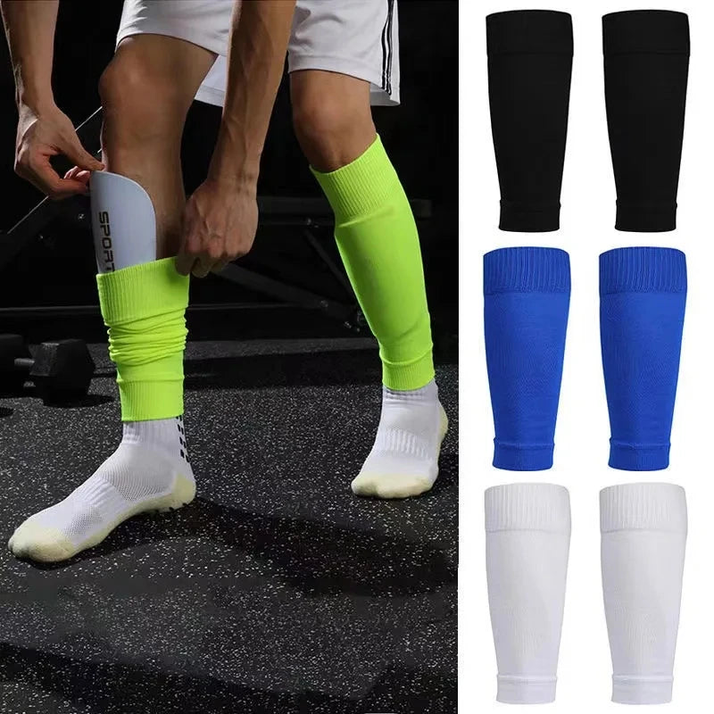 Pair of athletic shin guard sleeves in assorted colours, designed to hold football shin pads securely in place.