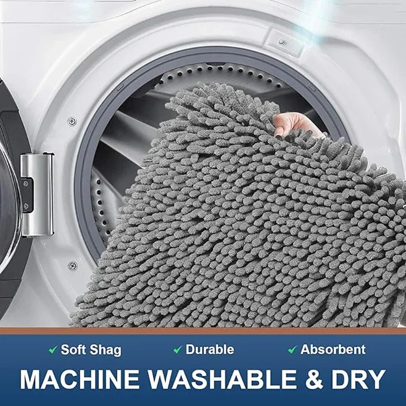 Grey, soft shag absorbent dog doormat being placed into a washing machine for easy cleaning.
