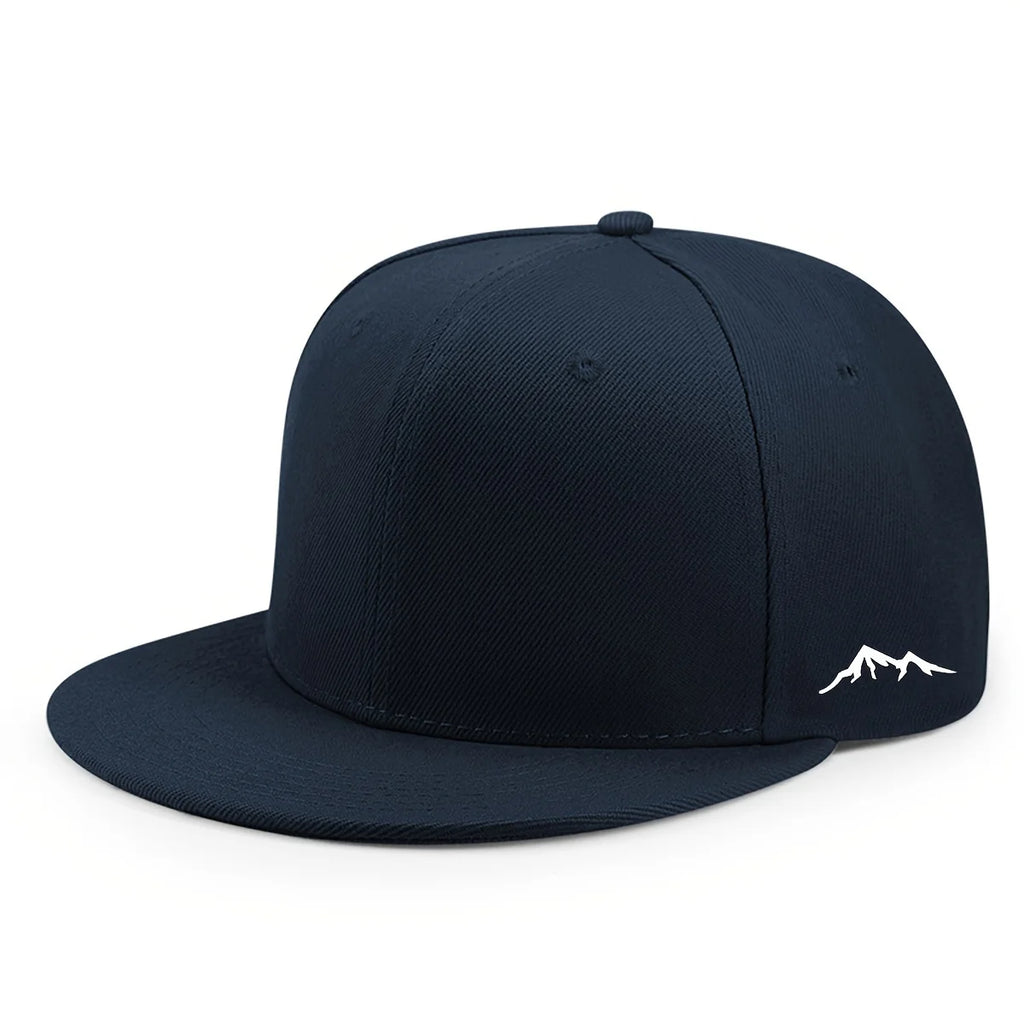 Navy blue flat brim cap with a white mountain range graphic on the side. Unisex, structured style.