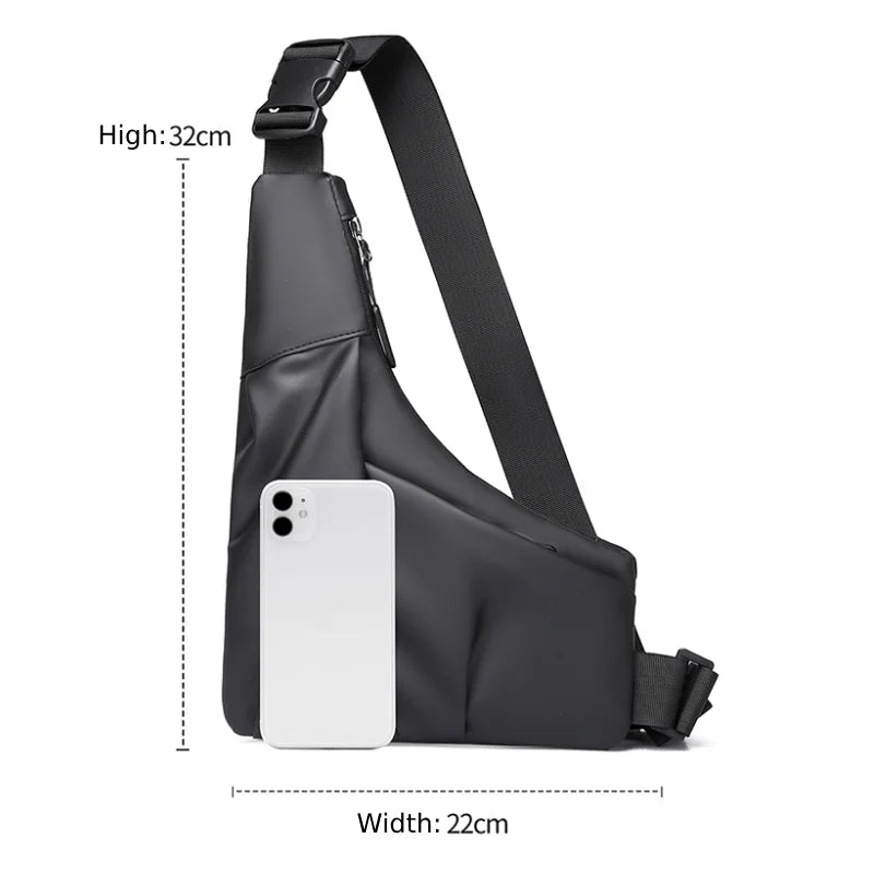 Black anti-theft triangle crossbody bag with an adjustable strap and white smartphone for size reference.